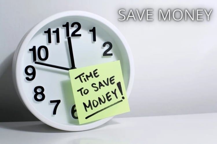 Young adult happily putting money in a piggy bank